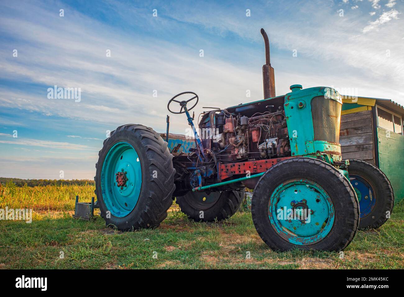 old tractor in field Stock Photo - Alamy