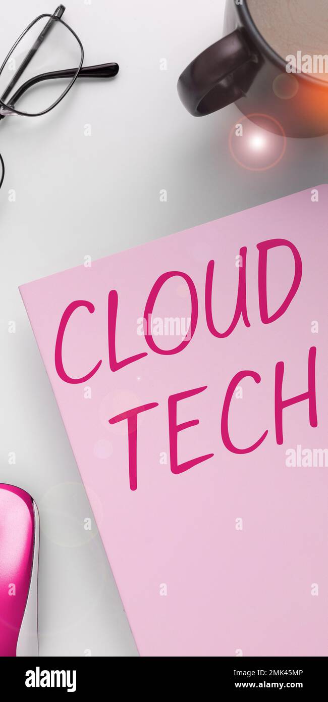 Hand writing sign Cloud Tech. Word for storing and accessing data and programs over the Internet Stock Photo