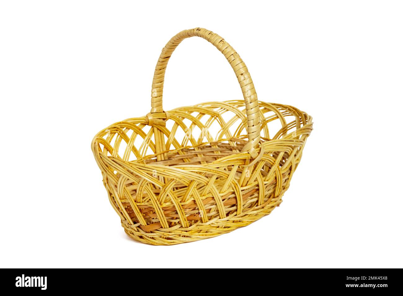 An empty wicker basket isolated on white background. Easter item Stock Photo