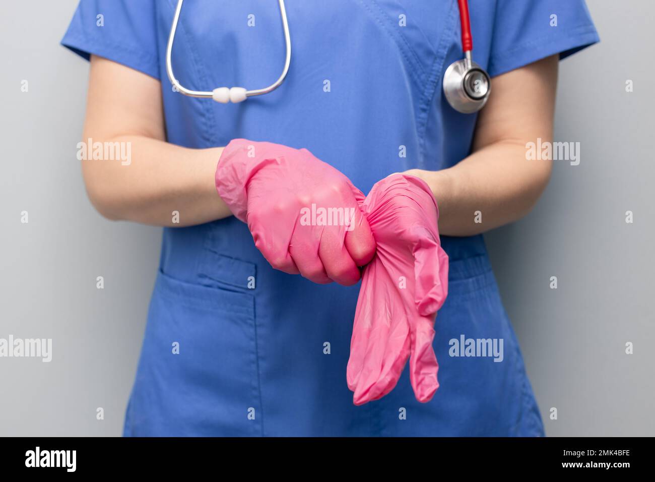 doctor in the hospital puts on a glove. doctor wear gloves. doctor