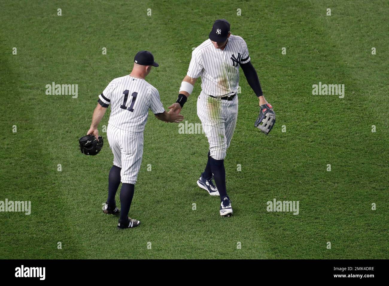 New York Yankees center fielder Brett Gardner (11) gives a tap of the