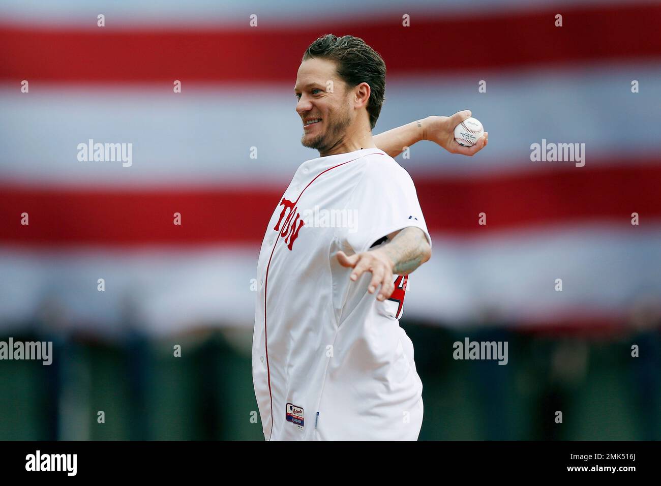 Former Boston Red Sox Jake Peavy throws out the ceremonial first pitch  before a baseball game between the Red Sox and the Baltimore Orioles in  Boston, Monday, April 15, 2019. (AP Photo/Michael