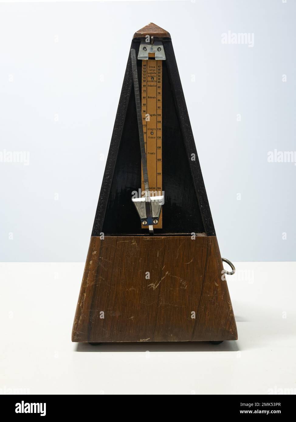 Antique metronome that produces an audible click or other sound at a