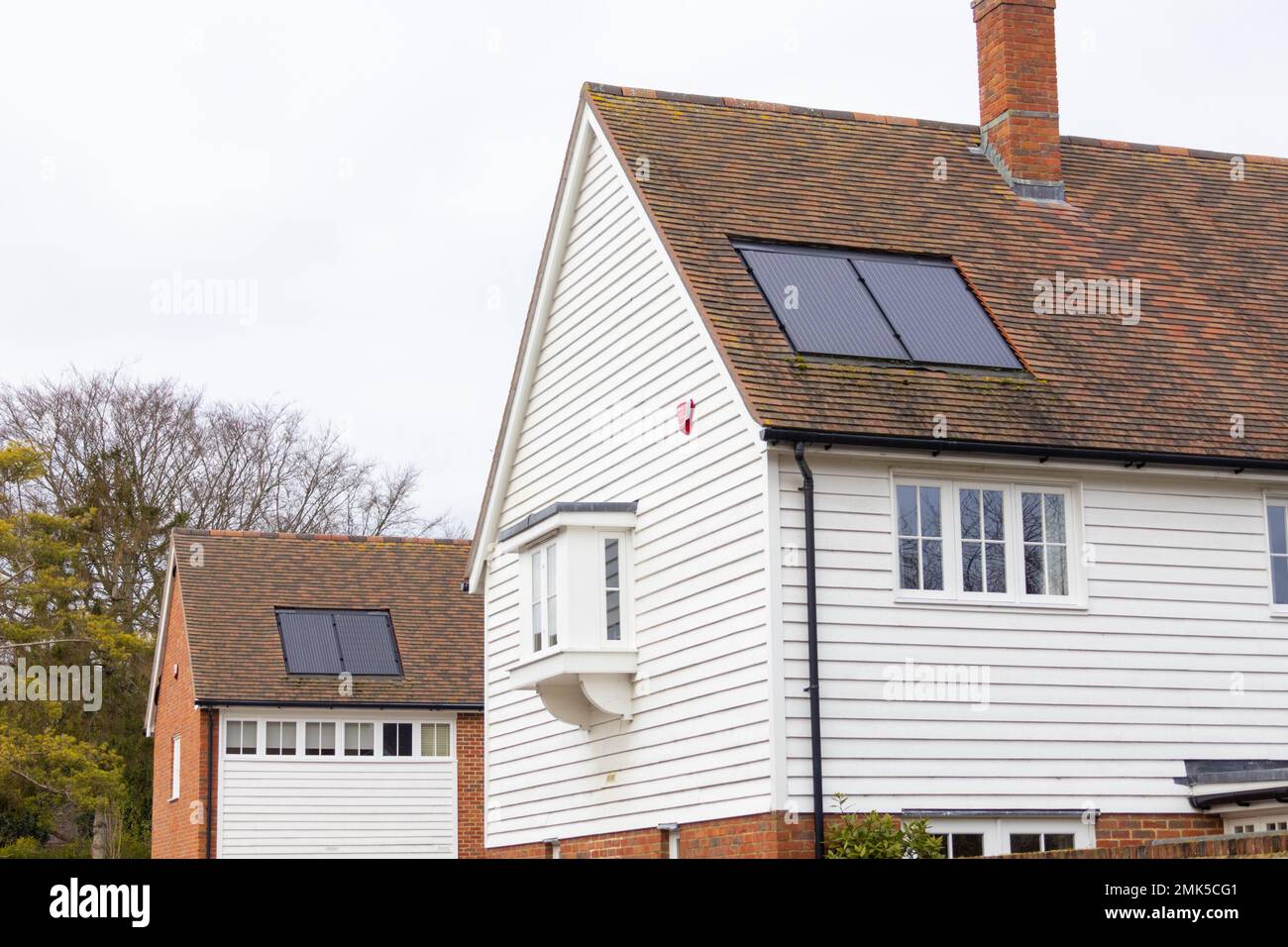 Solar panels integrated into roof of new build houses, lenham, kent, uk