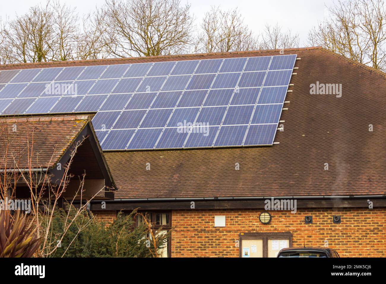 Solar panels on the roof of Lenham community centre, kent, uk Stock Photo