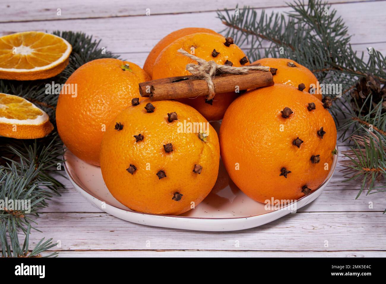 Christmas Oranges with Xmas Decor, Christmas Headdress on White Table Background - Image ID:2MK5E4C Stock Photo