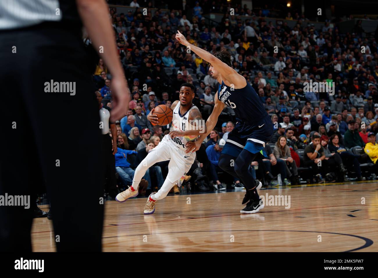 Denver Nuggets guard Monte Morris (11) and Minnesota Timberwolves ...