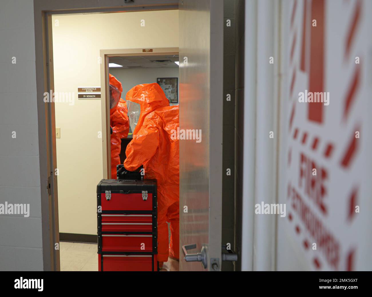 A team of two Kentucky National Guardsmen with the 75th Troop Command's, 41st Civil Support Team, walk through the conference room in the facilities building checking for chemical, biological or radiological remnants on Boone National Guard Center in Frankfort Sept. 6, 2022. This was all part of a scenario based exercise to prepare them for their external evaluations by Army North. Stock Photo