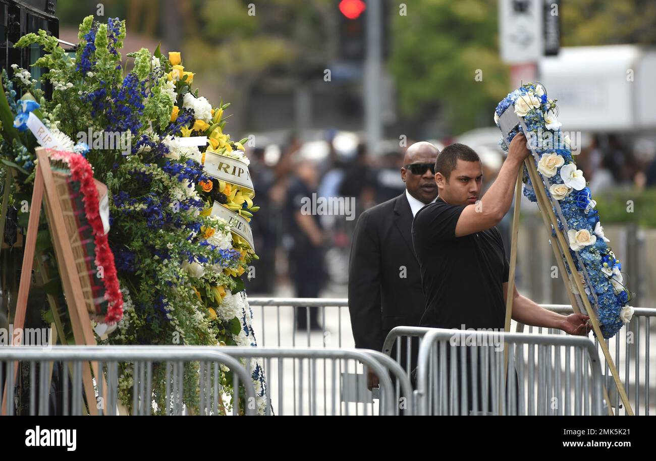 Flowers are placed at the Celebration of Life memorial service for late
