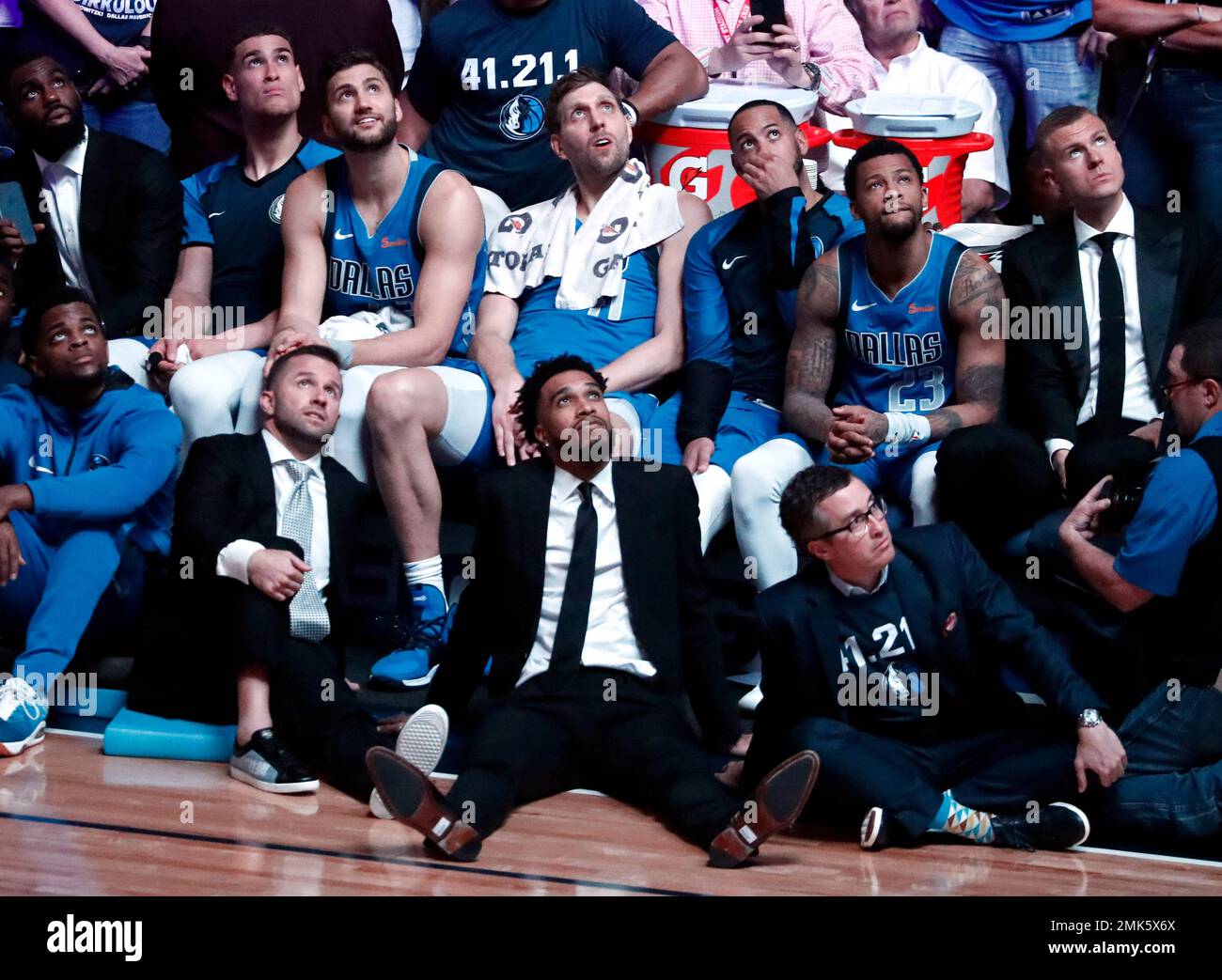 Dallas Mavericks players, from top left, Tim Hardaway Jr., Dwight Powell,  Maxi Kleber, Dirk Nowitzki, Devin Harris, Trey Burke and Kristaps  Porzingis, top right; and, from bottom left, Daryl Macon, J.J. Barea,