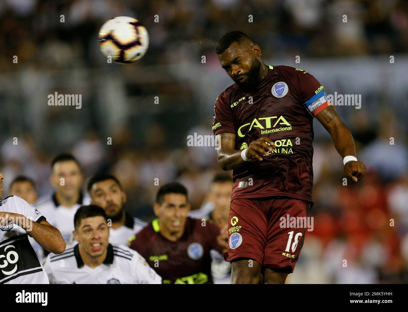 Santiago Damian Garcia Correa of Argentina's Godoy Cruz heads to score  against Paraguay's Olimpia during a Copa Libertadores soccer game in  Asuncion, Paraguay, Tuesday, April 9, 2019. (AP Photo/Jorge Saenz Stock  Photo 