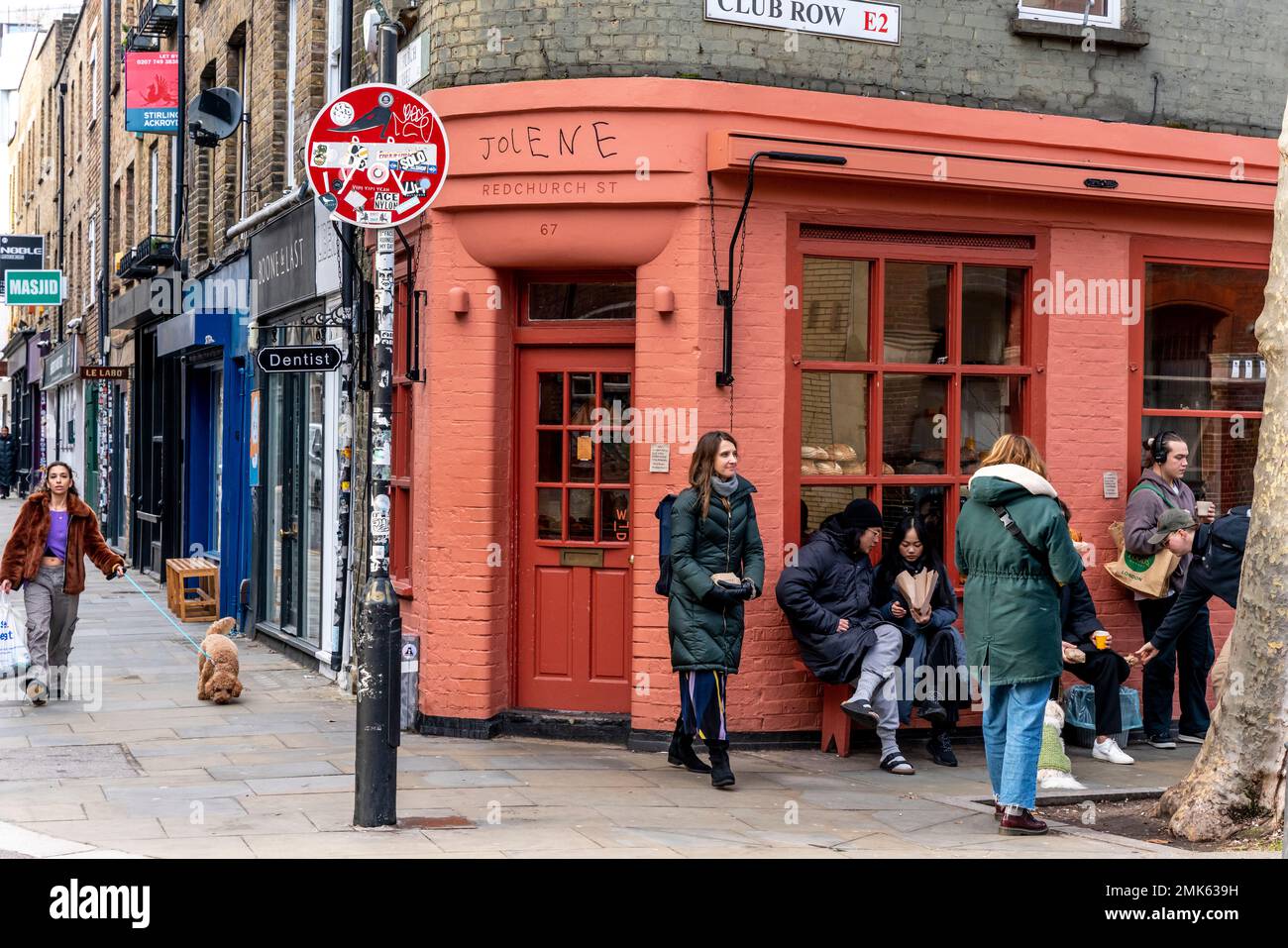 A Group Of People Sitting Outside The Jolene Bakery and Restaurant
