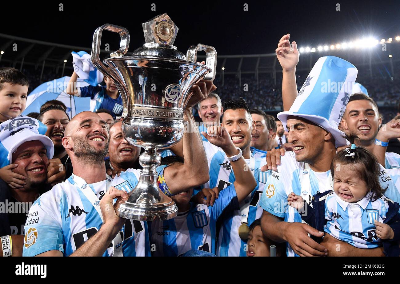 Racing Club players celebrate with their national league trophy after  defeating Defensa y Justicia in Buenos Aires, Argentina, Sunday, April 7,  2019. Racing Club, one of the five giants of Argentinian soccer