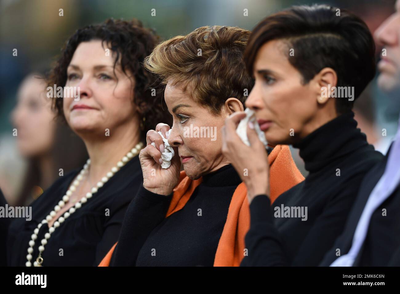 Wife of former Baltimore Oriole Frank Robinson Barbara, center, and  daughter Nichelle, right, wipe tears during a memorial ceremony before the  Baltimore Orioles and New York Yankees baseball game, Saturday, April 6