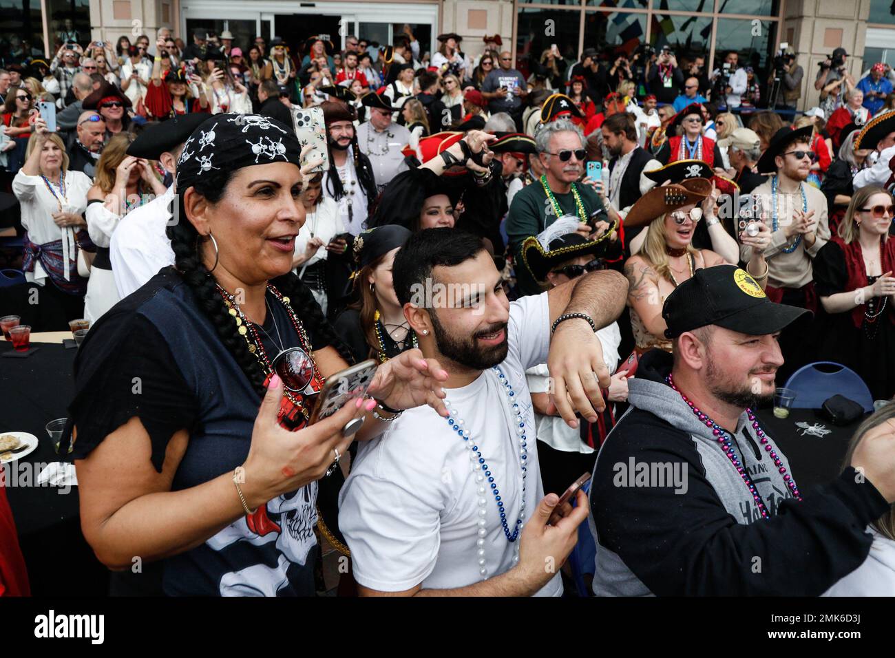 Tampa, Florida, USA. 28th Jan, 2023. The crowd watches, while Tampa Mayor Jane Castor, holds the key to the city as members of Ye Mystic Krewe of Gasparilla surround her at the Tampa Convention Center during the Gasparilla Invasion on Saturday, Jan. 28, 2023, in Tampa. (Credit Image: © Jefferee Woo/Tampa Bay Times via ZUMA Press Wire) EDITORIAL USAGE ONLY! Not for Commercial USAGE! Stock Photo