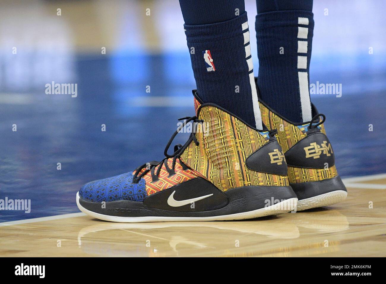 The shoes of Minnesota Timberwolves center Karl-Anthony Towns (32) are  viewed as he stands on the court during the second half of an NBA  basketball game against the Orlando Magic Thursday, Feb.