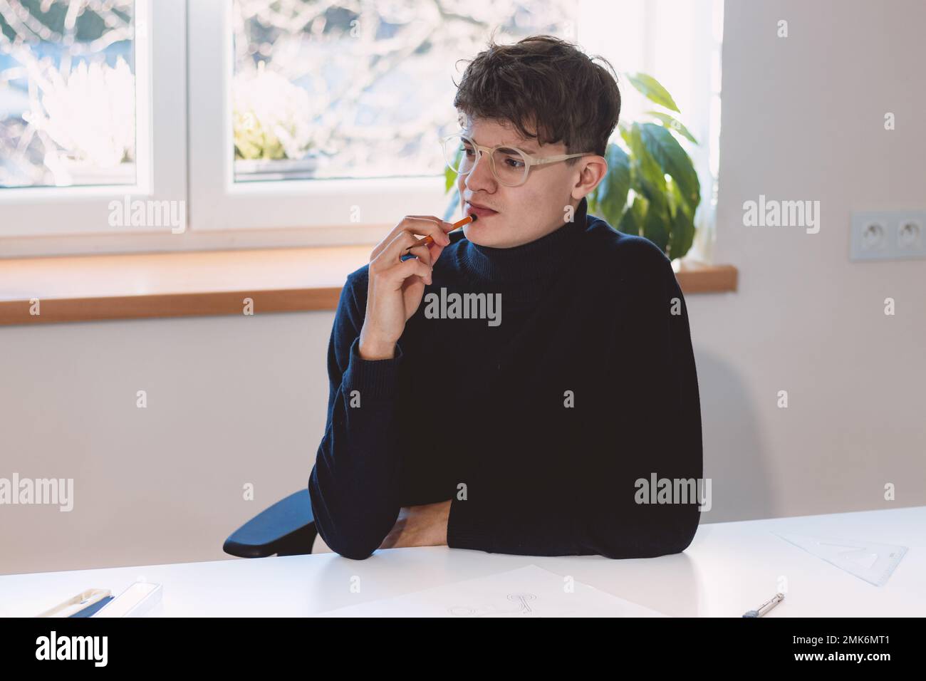Brown-haired architect creates new product designs for a new futuristic ...