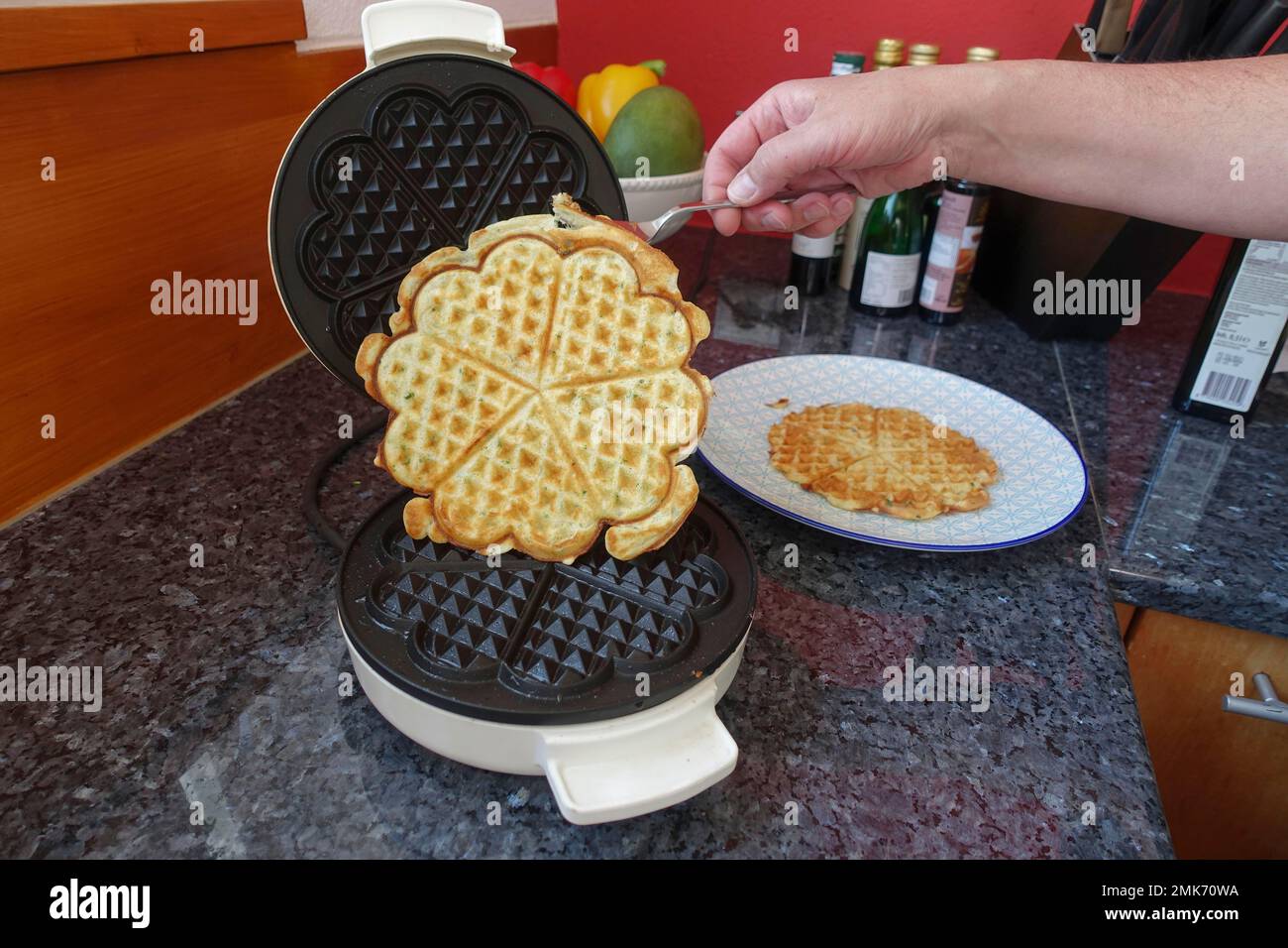 Southern German cuisine, preparation waffles, waffle iron, man's hand,  Germany Stock Photo - Alamy