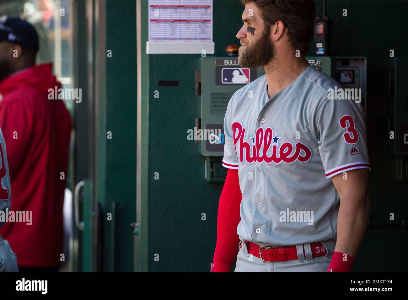 Philadelphia Phillies' Bryce Harper (3) wears a belt with (34) on it, his  old number, in the dugout during the fifth inning of a baseball game  against the Washington Nationals at Nationals