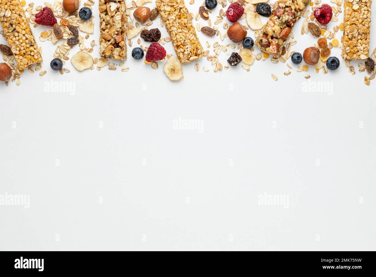 top view breakfast cereal bars with fruits copy space. High resolution