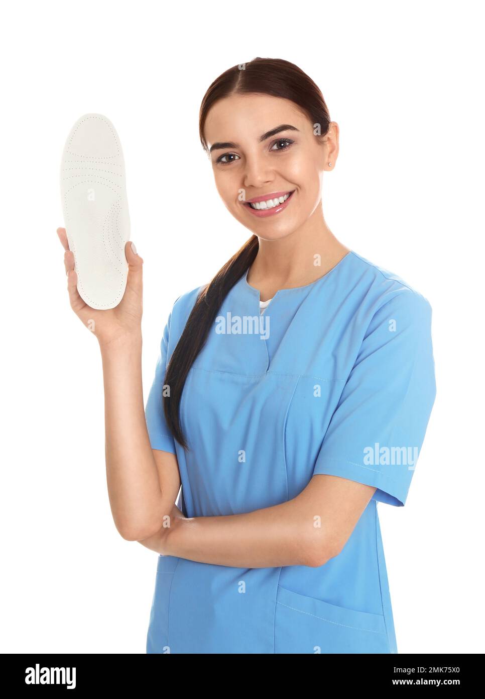 Female orthopedist showing insole on white background Stock Photo Alamy
