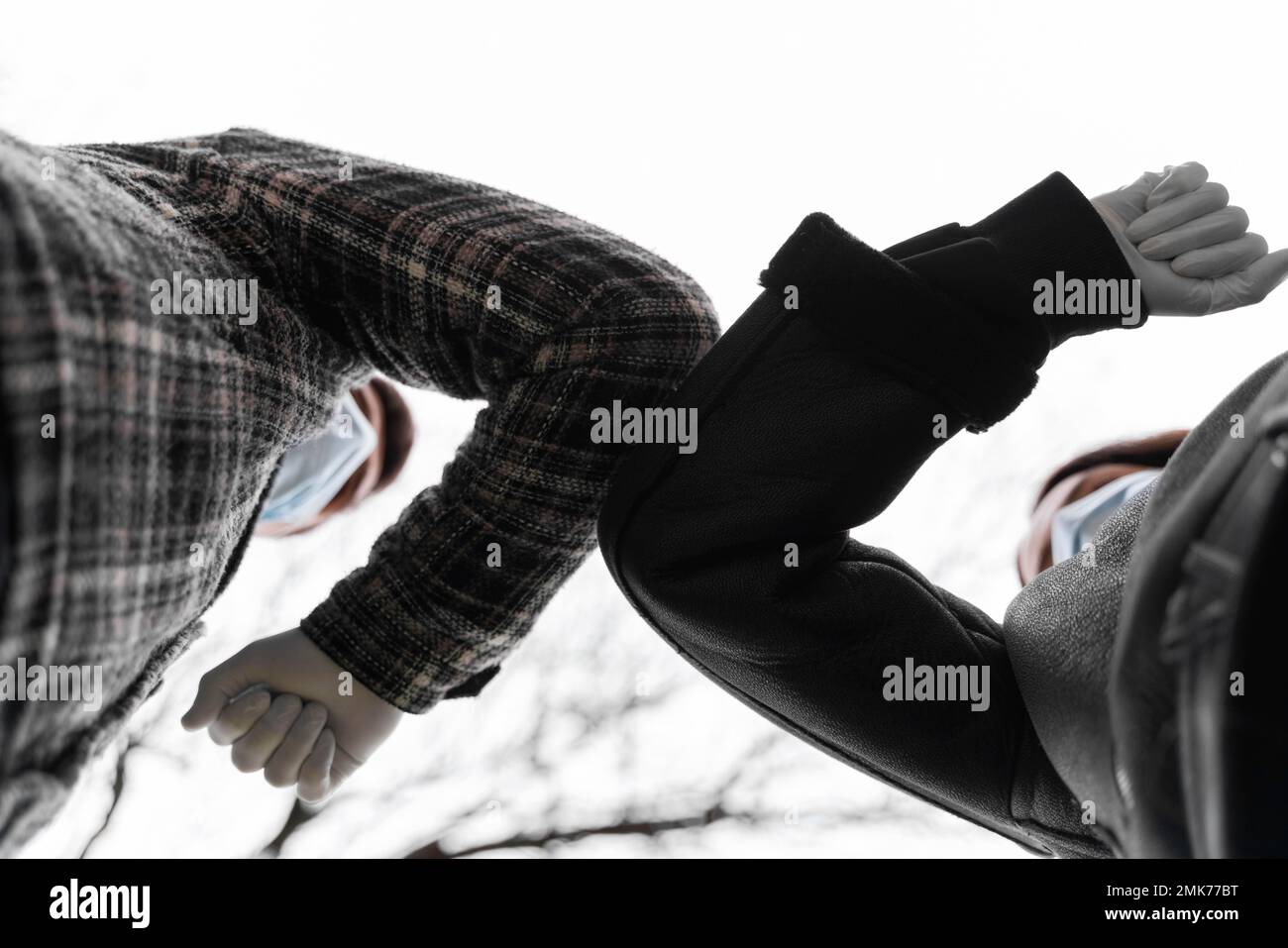 elbow bump alternative greetings ground view. High resolution photo