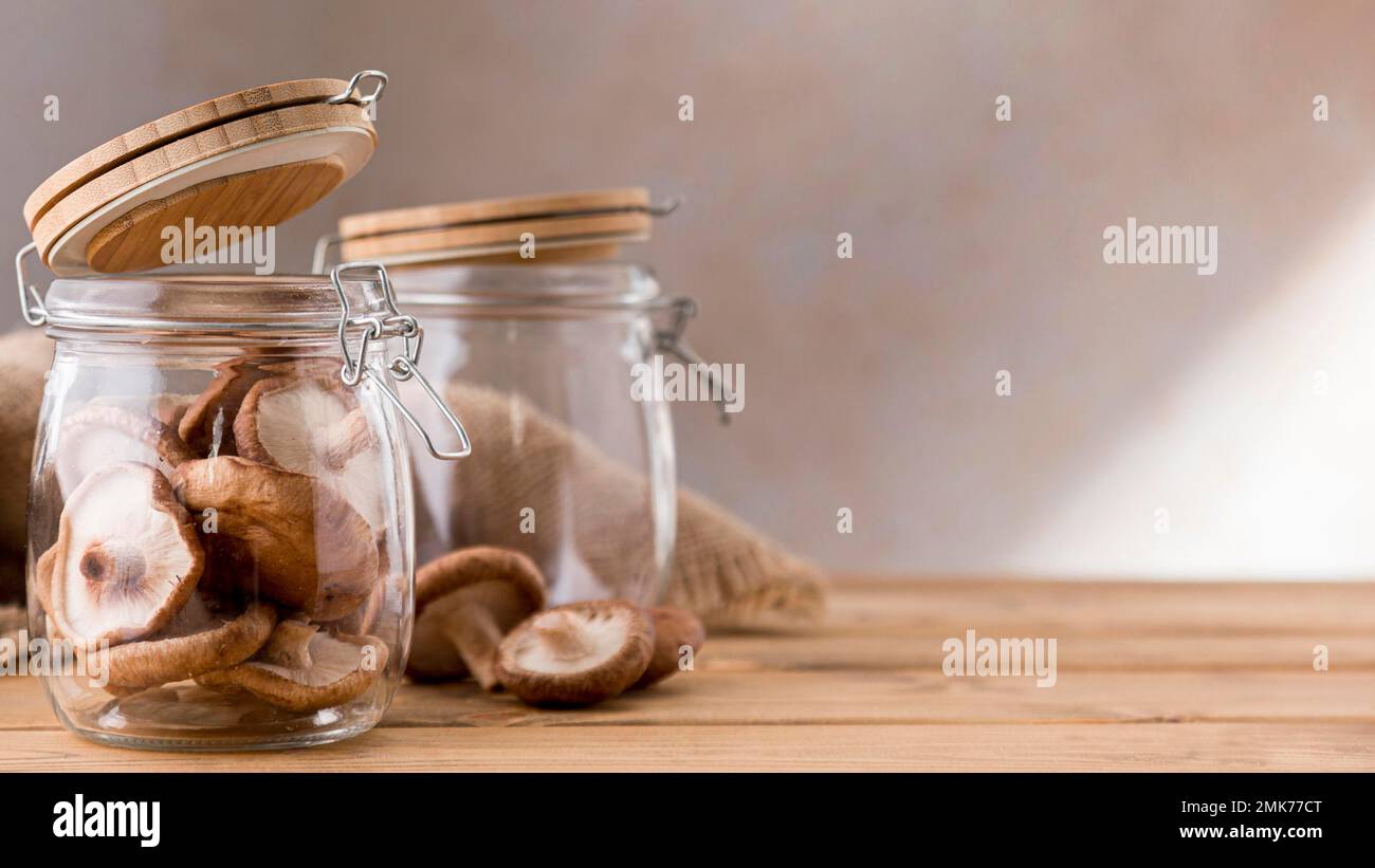 front view mushrooms clear jars. High resolution photo Stock Photo