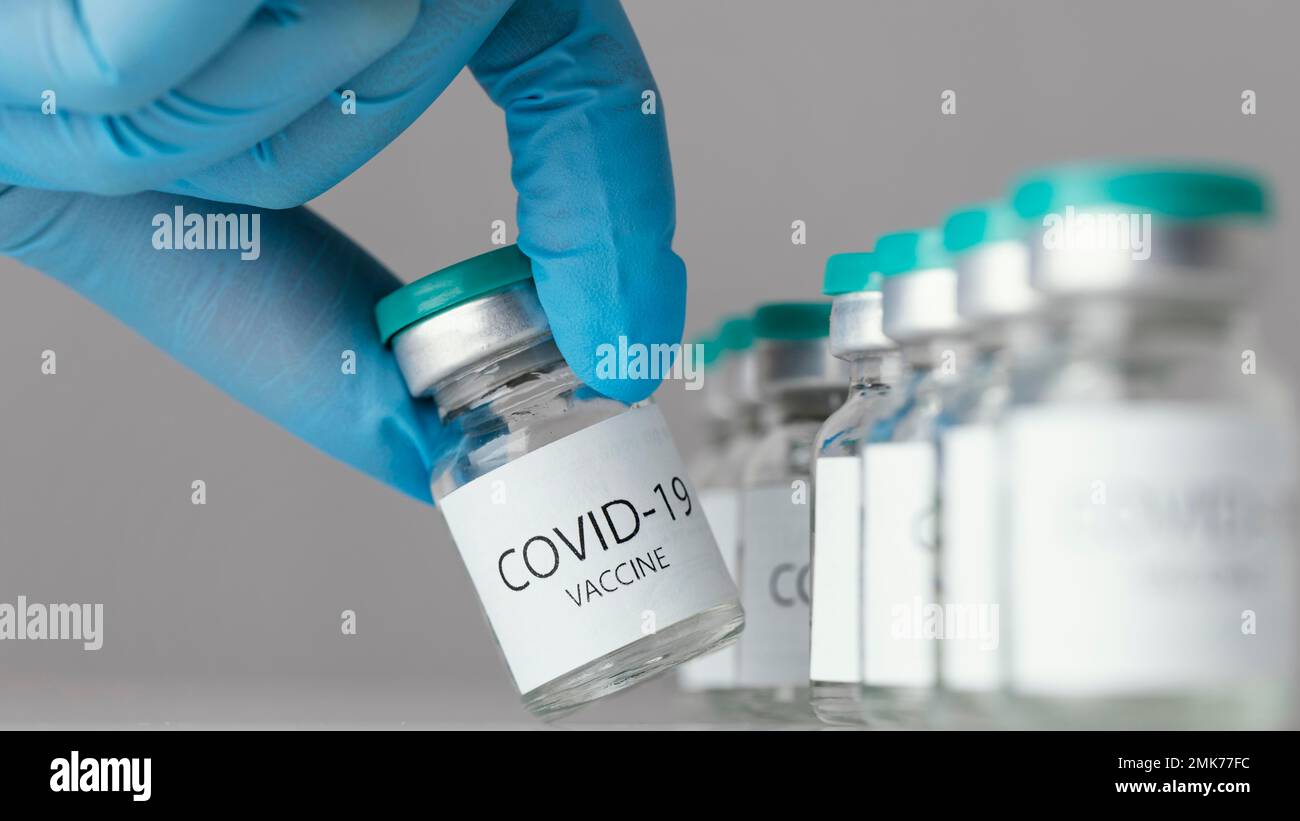 doctor holding covid 19 vaccine bottle. High resolution photo Stock Photo