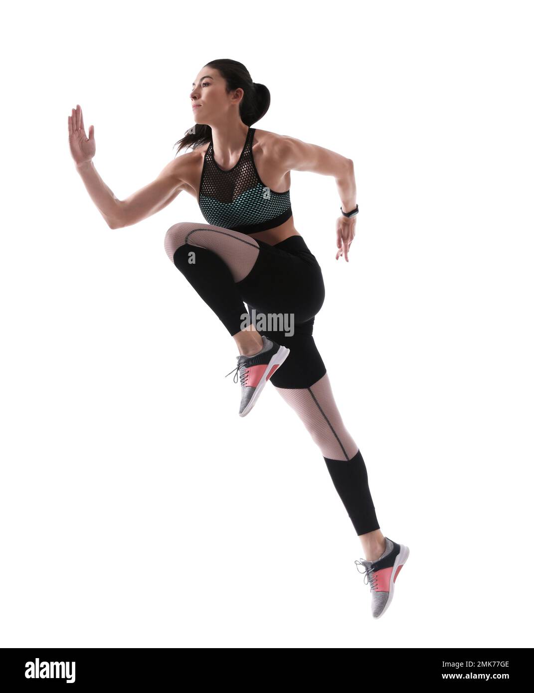 Athletic young woman running on white background, side view Stock Photo ...