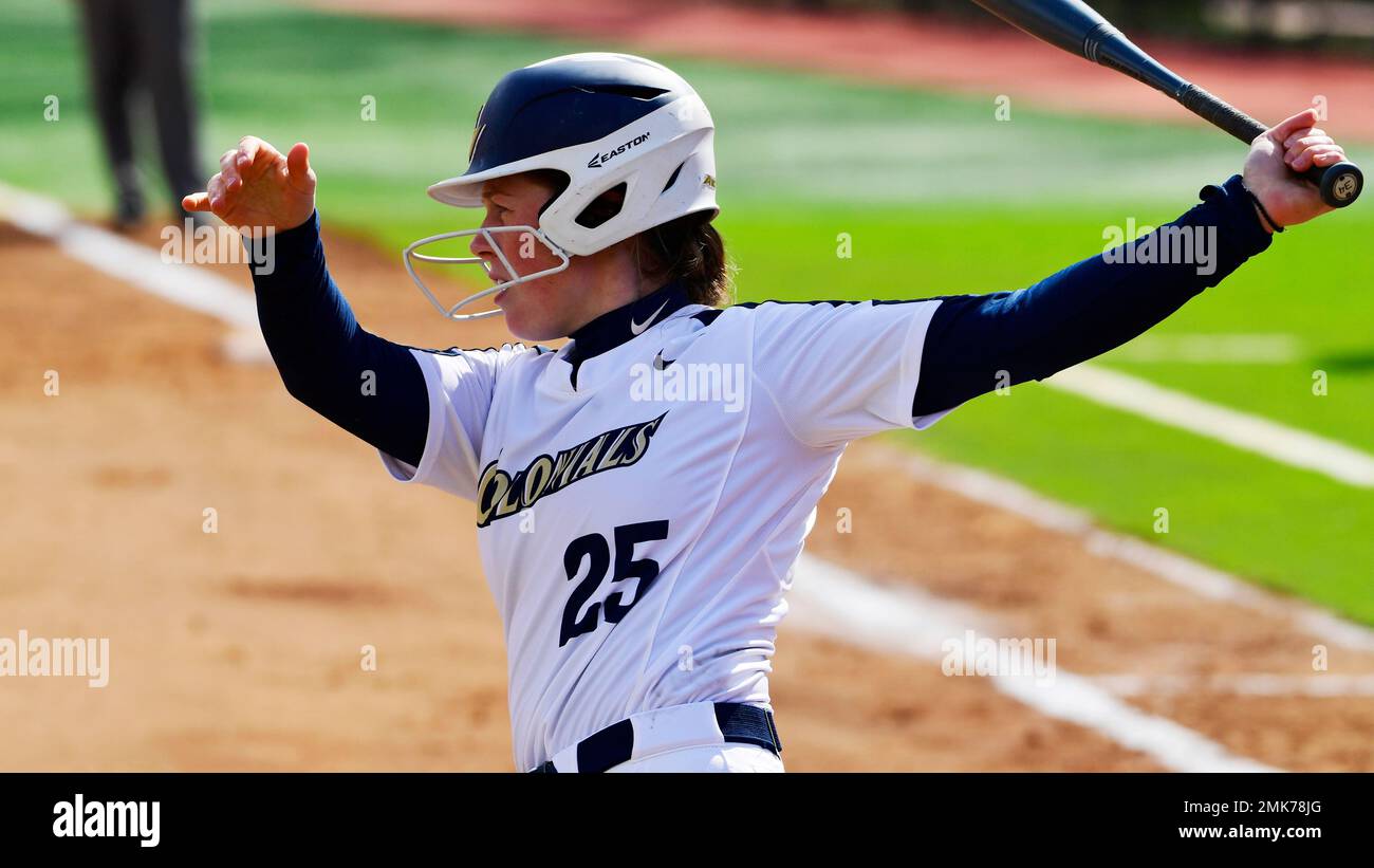 George Washington's Morgan Kummer takes a practice swing during the second  inning of an NCAA college softball game at SJU Softball Field, Sunday,  March 31, 2019, in Philadelphia, Pa. St. Joseph's defeated