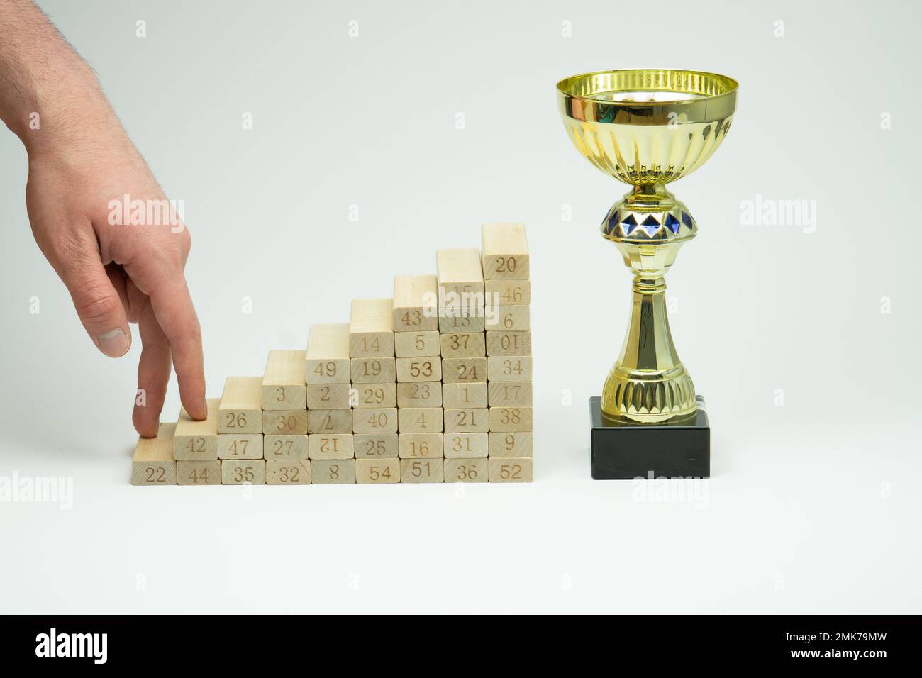 Male man hand climbing stairs on white background, concept for growth in life. Career ladder. Professional development, aims achievement. Stock Photo