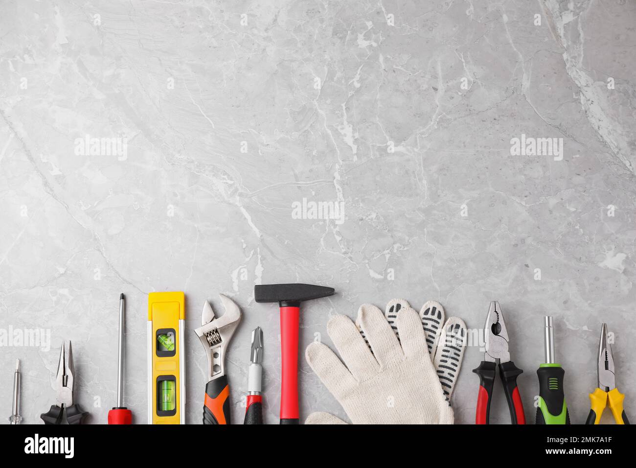 Flat lay composition with different construction tools on marble ...