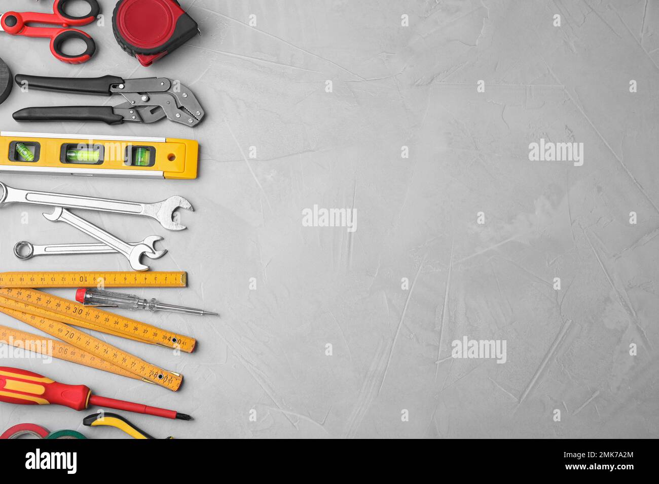 Flat lay composition with construction tools on light grey background ...
