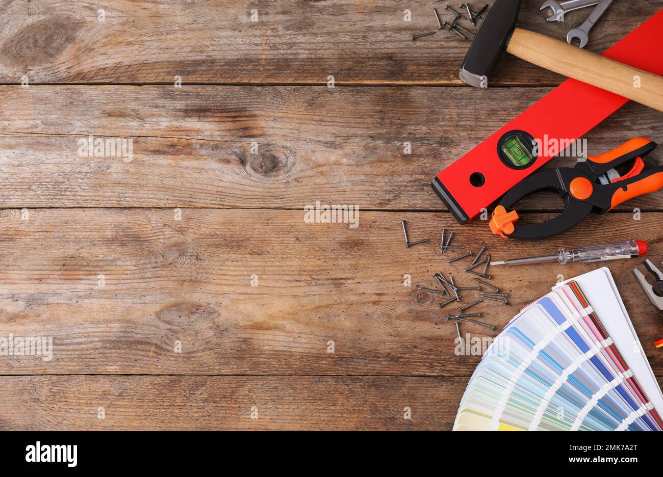 Flat lay composition with construction tools on wooden background ...