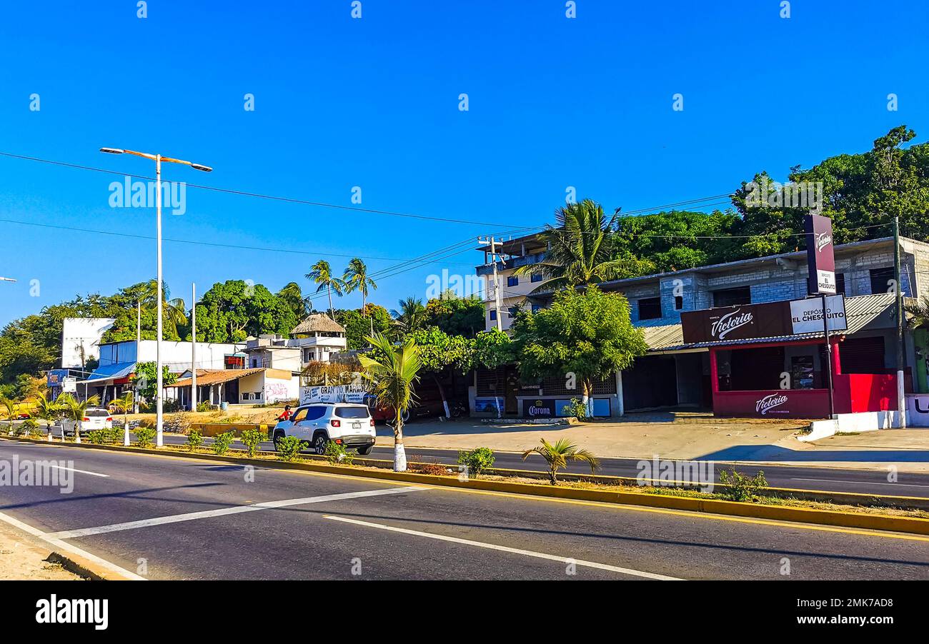 Puerto Escondido Oaxaca Mexico 2022 Busy road street driving cars