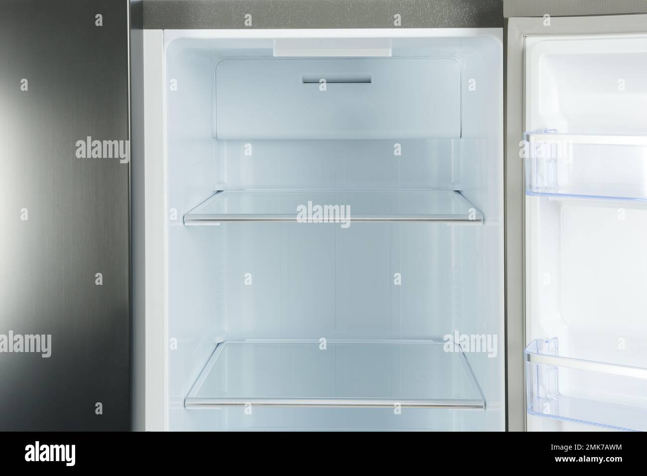 Shelves of empty modern refrigerator, closeup view Stock Photo