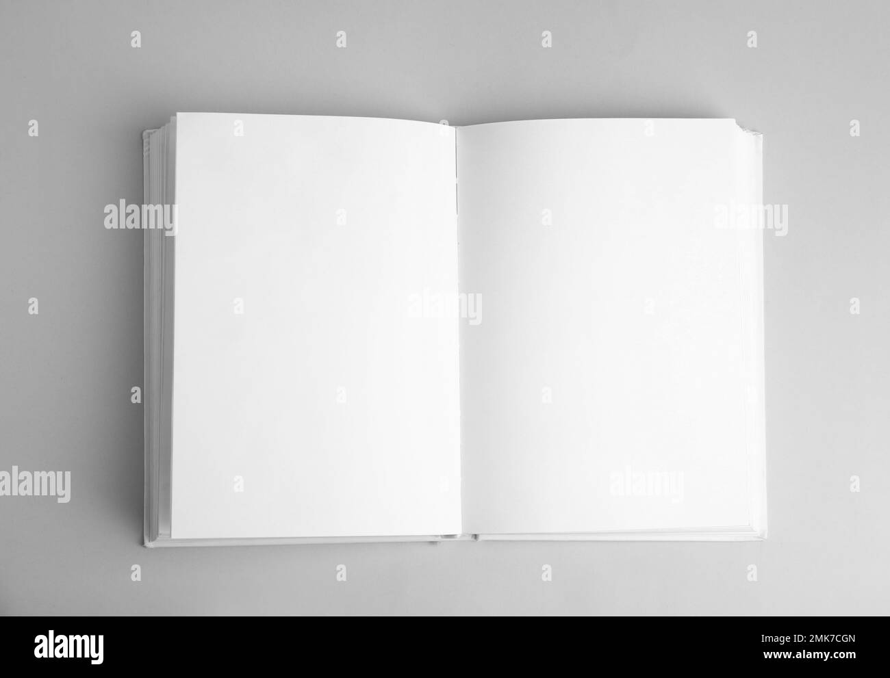 Open book with blank pages on grey background, top view Stock Photo Alamy