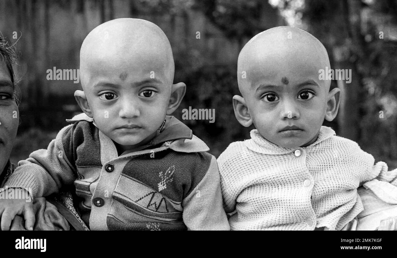 black and white photo, Indian non identical twins, boys with shaved heads, Tamil Nadu, India, Asia Stock Photo