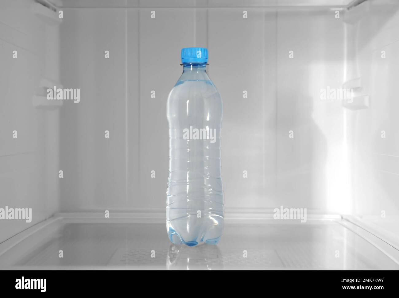 mini fridge full of bottled water isolated on white Stock Photo - Alamy