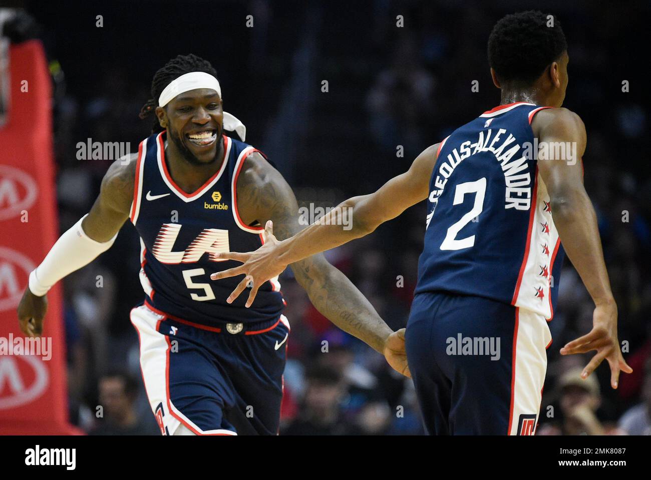 Los Angeles Clippers forward Montrezl Harrell, left, celebrates with guard  Shai Gilgeous-Alexander after making a basket during the first half of an  NBA basketball game against the Cleveland Cavaliers in Los Angeles,
