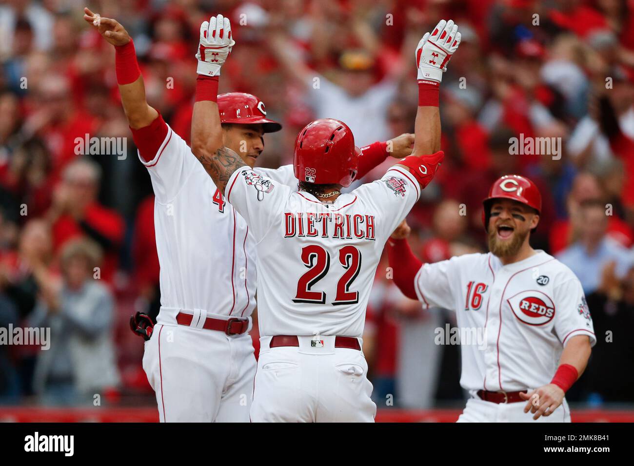 Cincinnati Reds' Derek Dietrich (22) celebrates his three-run home