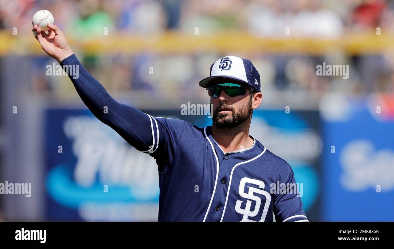 San Diego Padres' Luis Urias lines out while batting during the ninth  inning of a baseball game against the Los Angeles Dodgers Wednesday, Aug.  28, 2019, in San Diego. (AP Photo/Gregory Bull