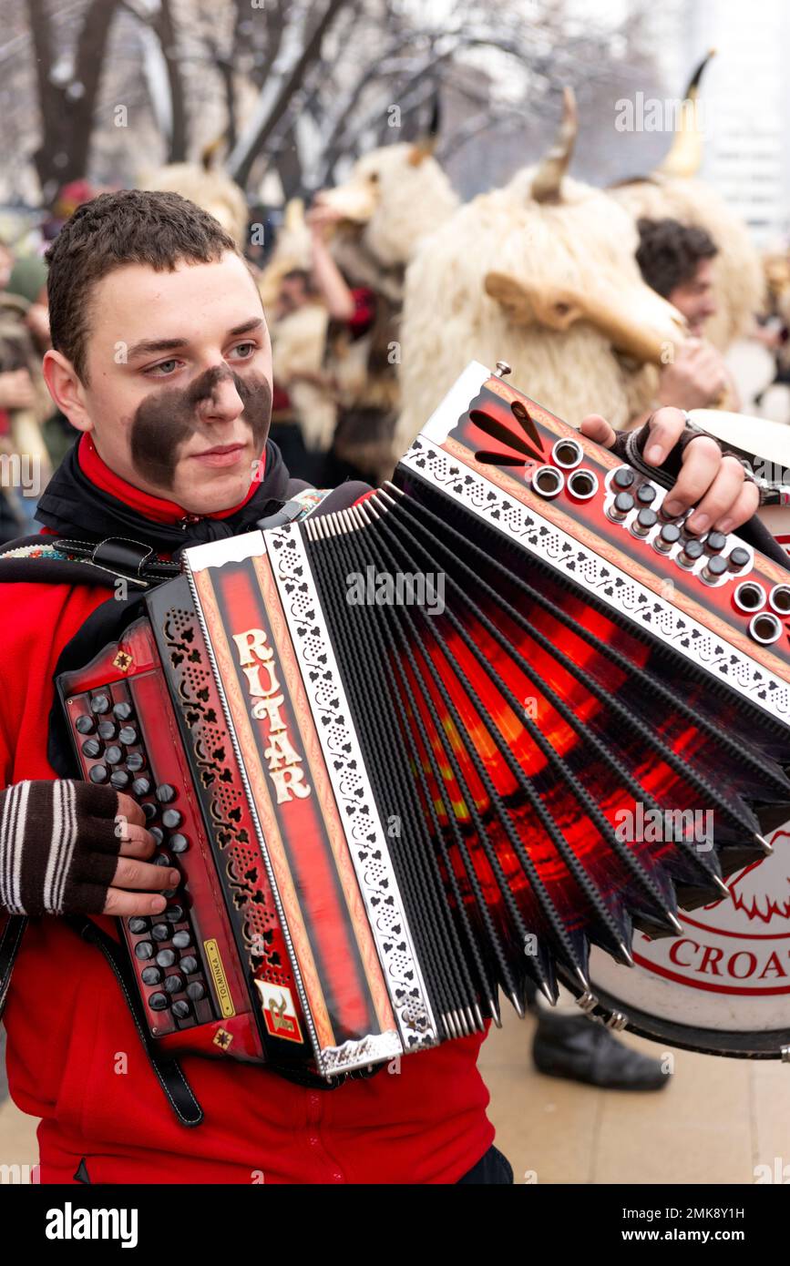 Pernik, Bulgaria. 28 January 2023. Accordion Player From Croatia At The  Surva International Festival Of Masquerade Games Is The Biggest Winter  Festival In Europe And, The Most Popular And Authoritative Manifestation Of