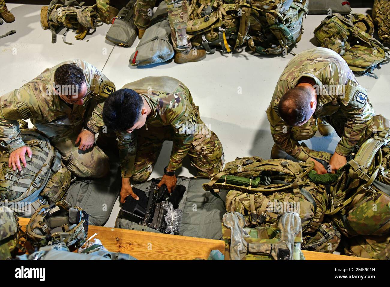 U.S. Army Paratroopers assigned to the 173rd Airborne Brigade, adjust ...