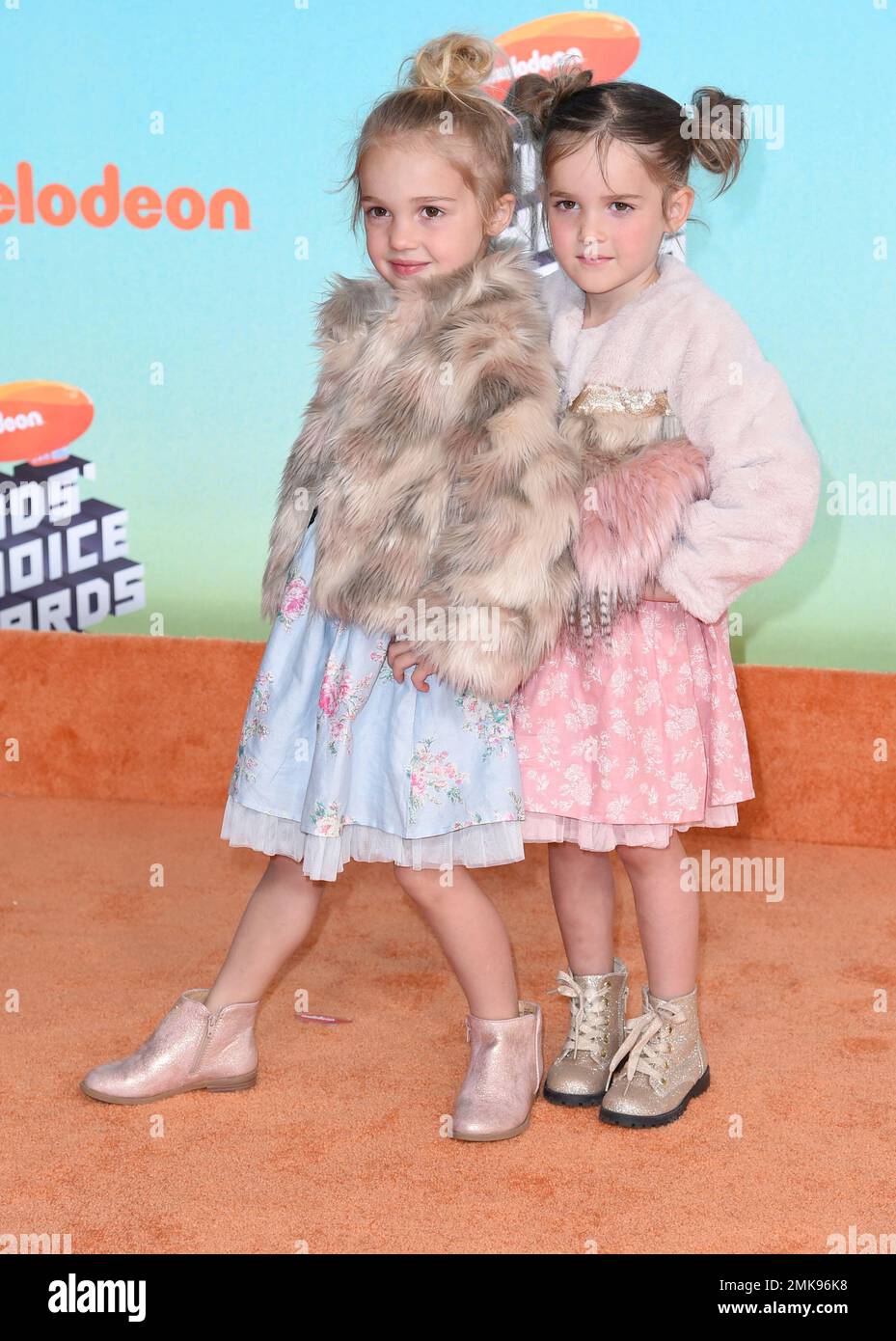 Emma Stauffer, left, and Mila Stauffer arrive at the Nickelodeon Kids' Choice Awards on Saturday