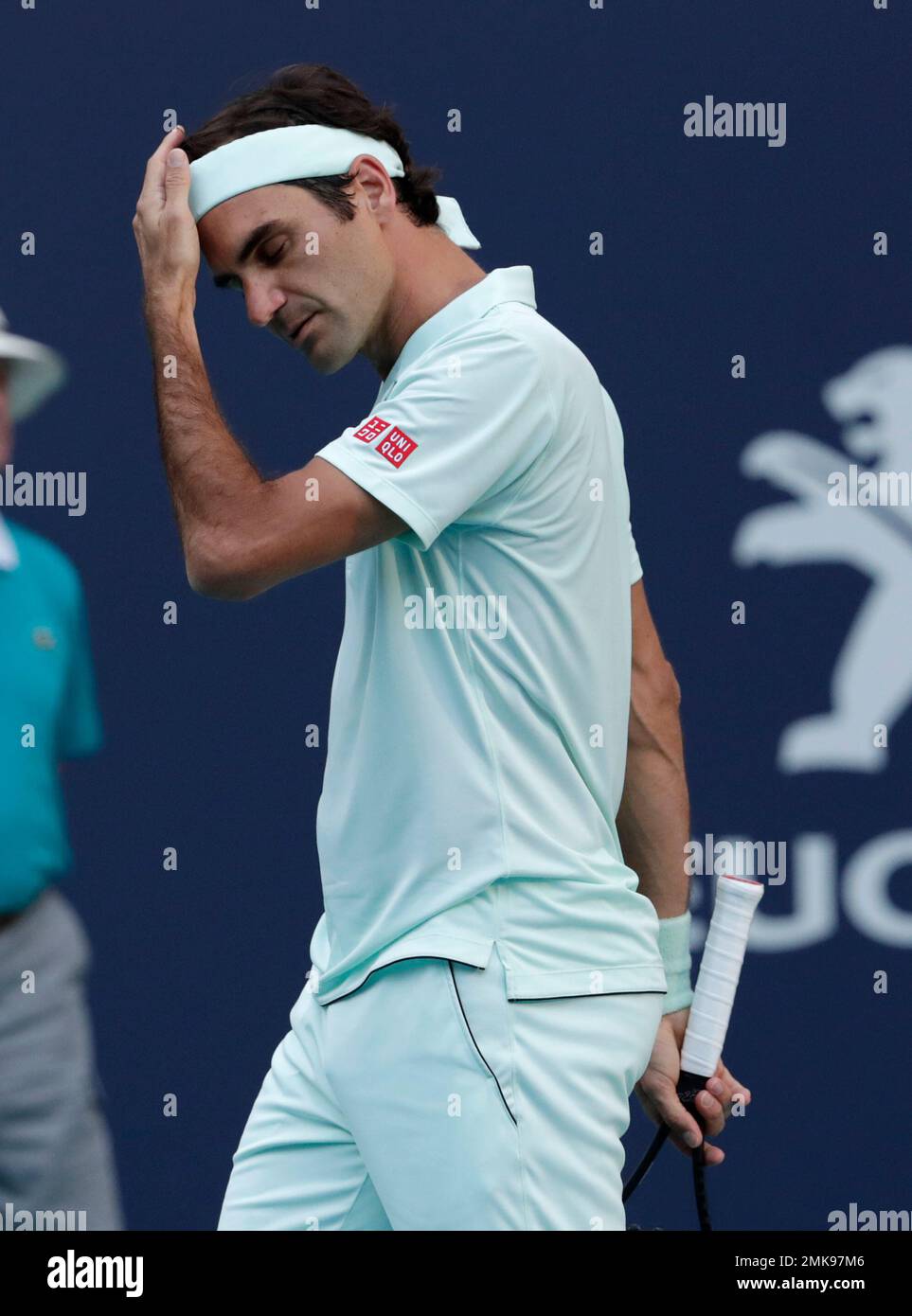 Roger Federer of Switzerland adjusts his headband during his match against Radu Albot of Moldova during the Miami Open tennis tournament Saturday March 23 2019 in Miami Gardens Fla. AP Photo Lynne Sla...