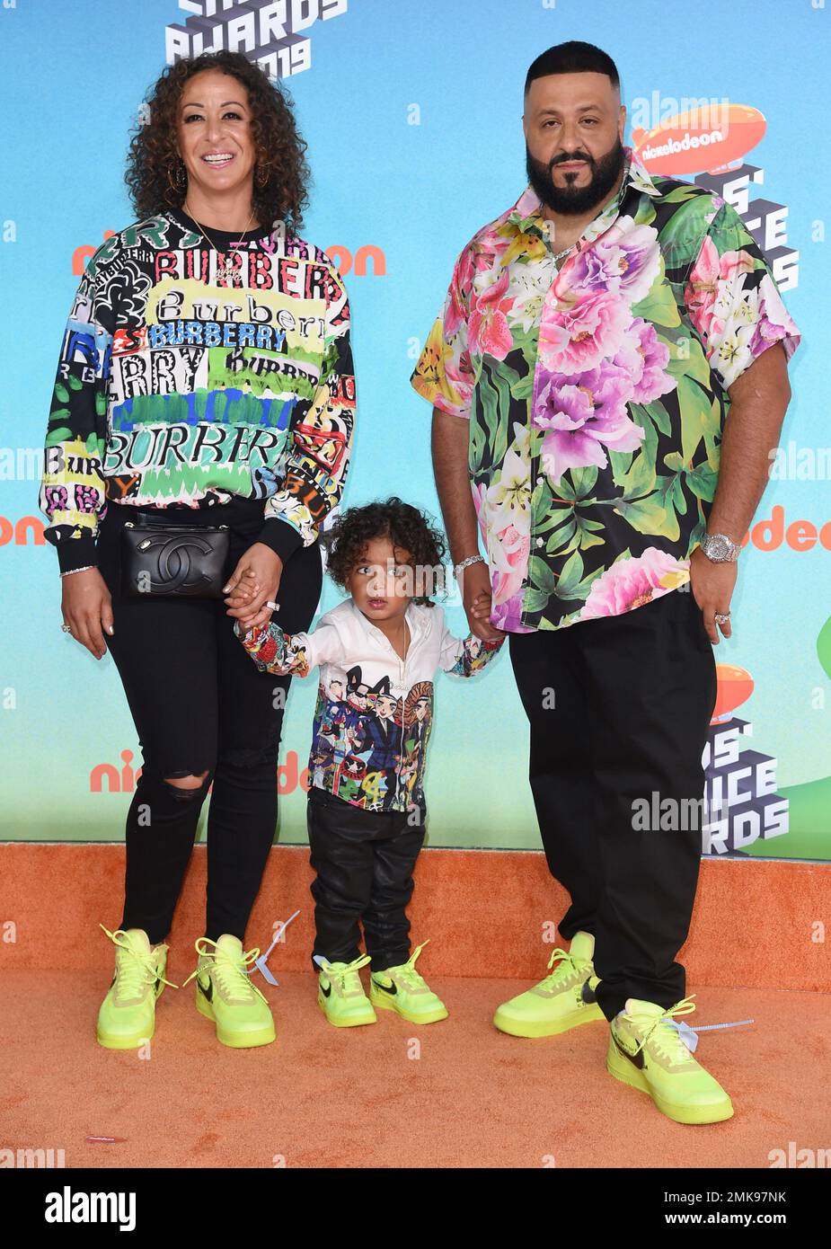 DJ Khaled, right, and Nicole Tuck, left, arrive with their son Asahd at