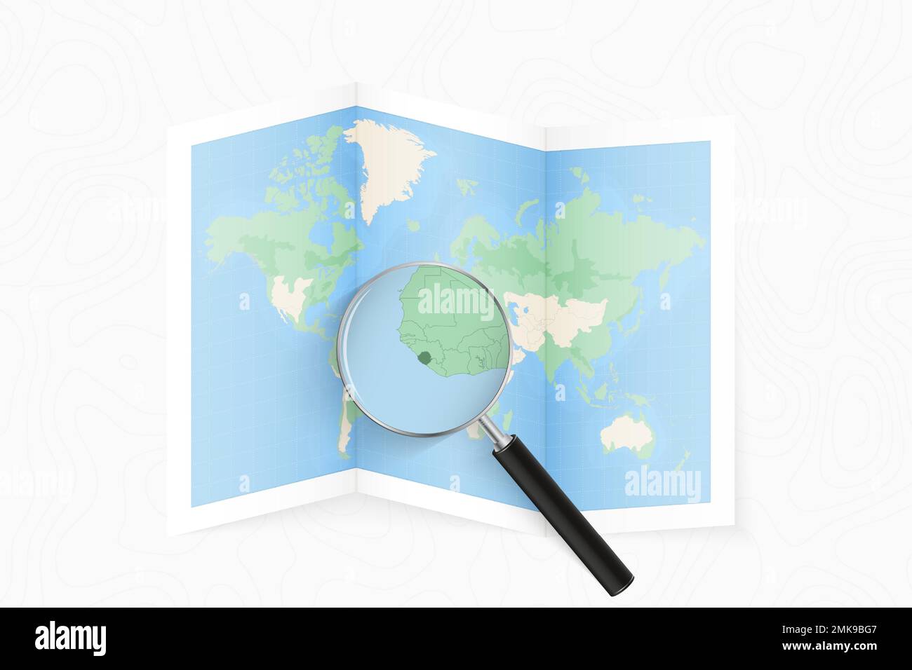 Enlarge Sierra Leone with a magnifying glass on a folded map of the ...