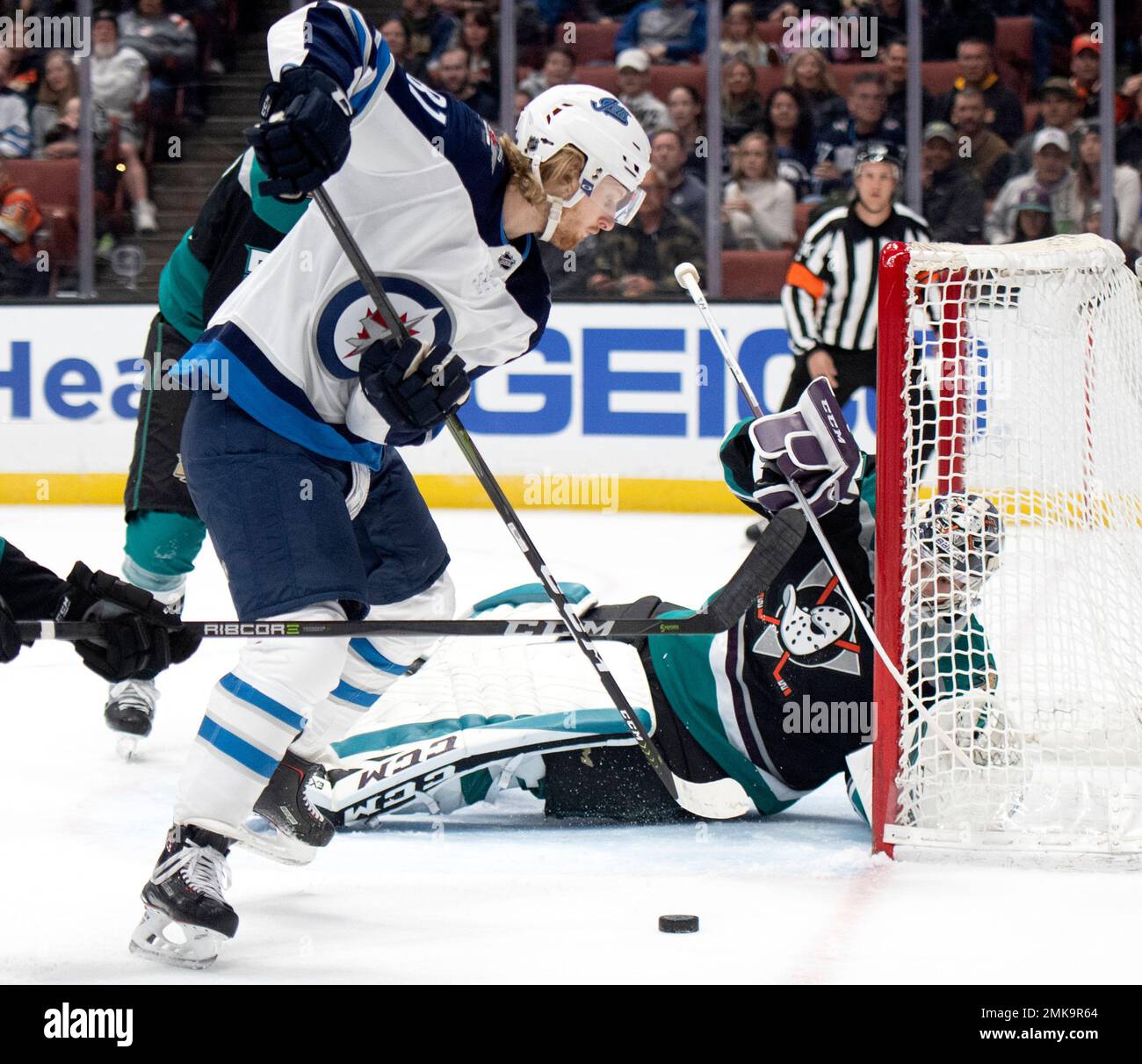 Winnipeg Jets' Patrik Laine (29), of Finland, and Bryan Little (18)  celebrate Little's goal against the Vancouver Canucks during the first  period of an NHL hockey game in Vancouver, on Monday November