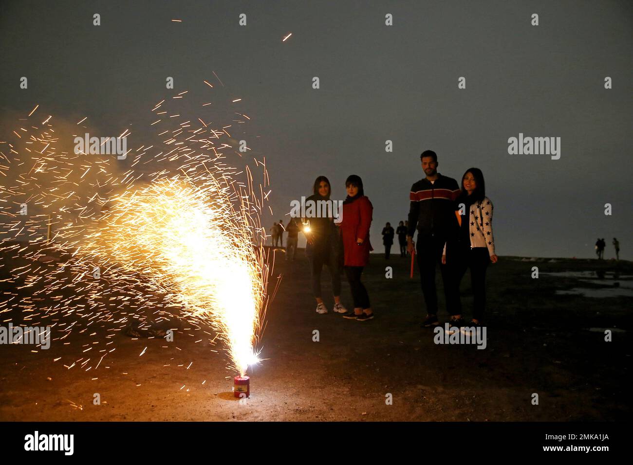 Iranians light fireworks during a celebration, known as "Chaharshanbe Souri," or Wednesday Feast
